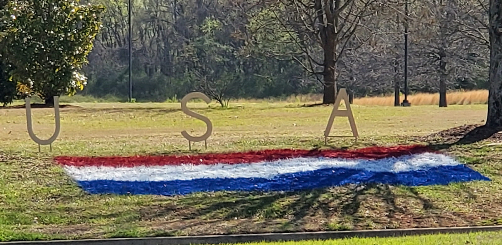 The letters "USA" decorate the side of the road where the races took place.