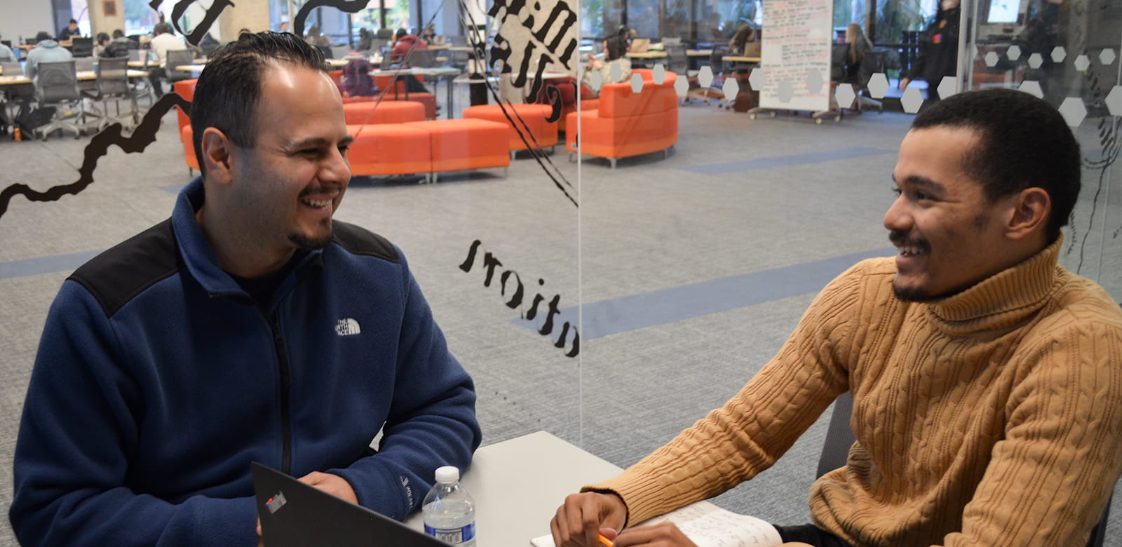 Student Patrick with his mentor, Carlos