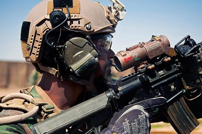 A U.S. Marine Special Operations Team member in Afghanistan's Helmand province, using an ELCAN Specter® DR 1-4x dual role weapon sight. 
