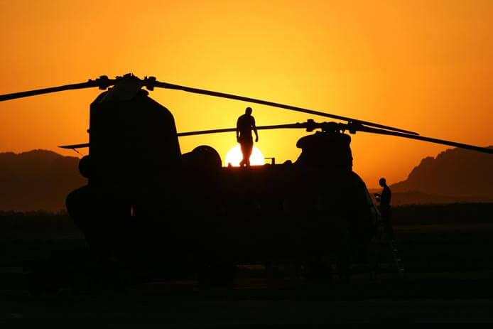 U.S. Army helicopter maintainers inspect a MH-47 Chinook from 160th Special Operations Aviation Regiment.