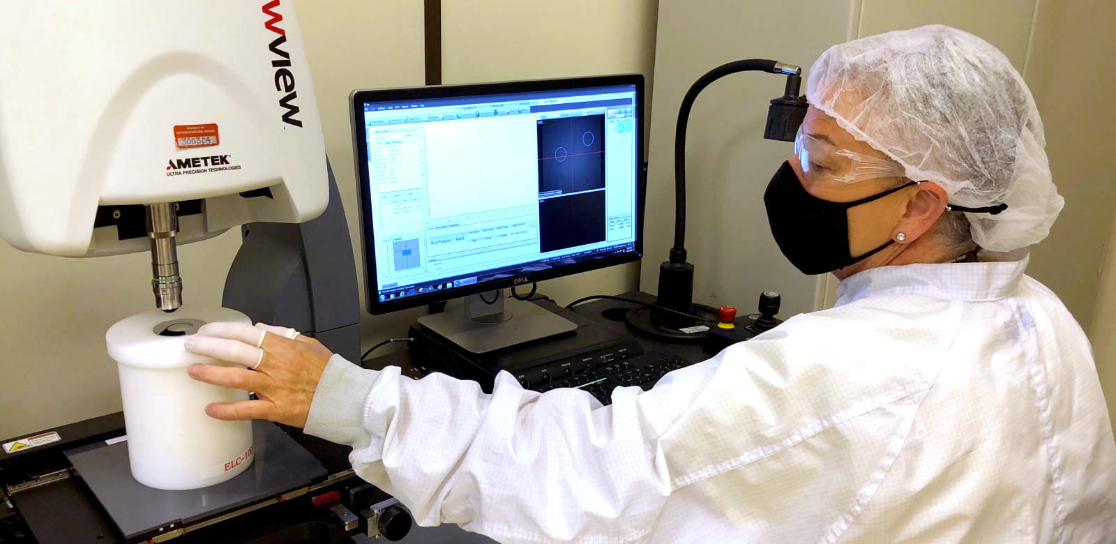 Raytheon ELCAN thin film coating technician measures surface smoothness