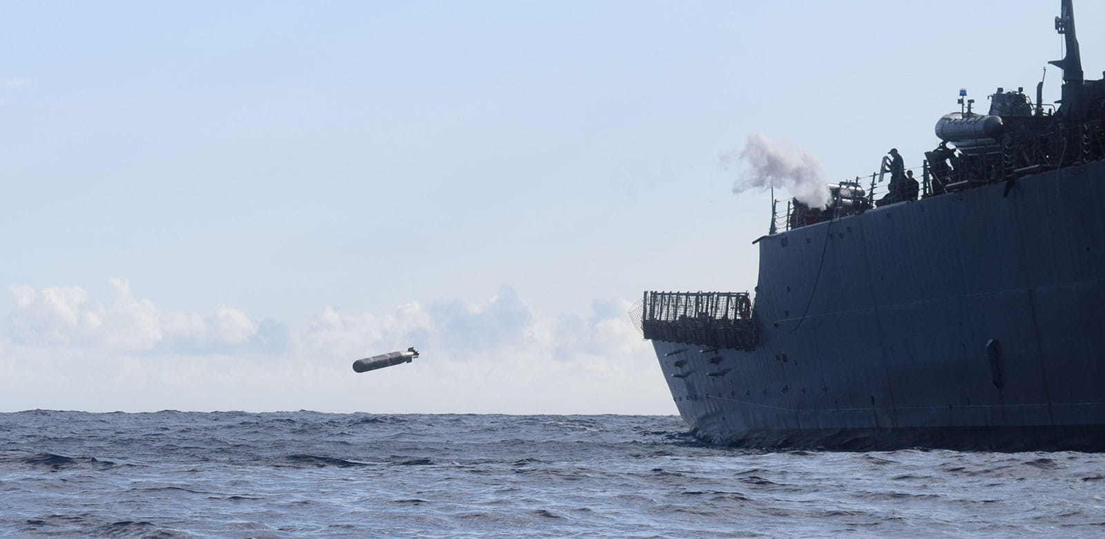 The guided missile destroyer USS O'Kane(DDG 77) fires a Mk54 recoverable exercise torpedo out of the Surface Vessel Torpedo Tube during Combat Systems Ship Qualifications and Trials (U.S. Navy Photo by Yeoman 3rd Class Armand Garcia/Released)