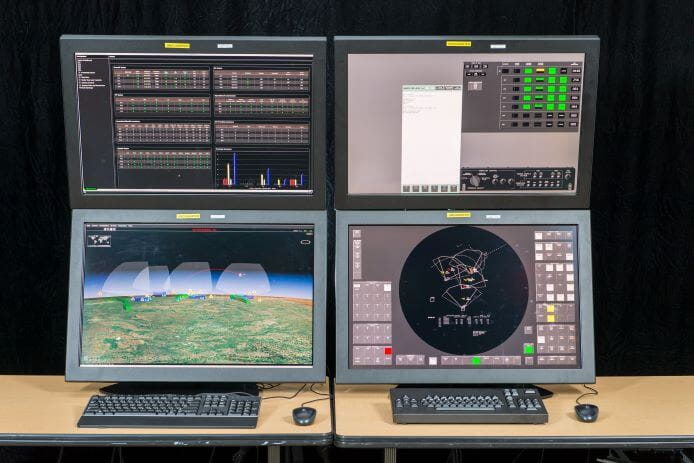 The Patriot Warfighter Machine Interface is shown on four monitors.