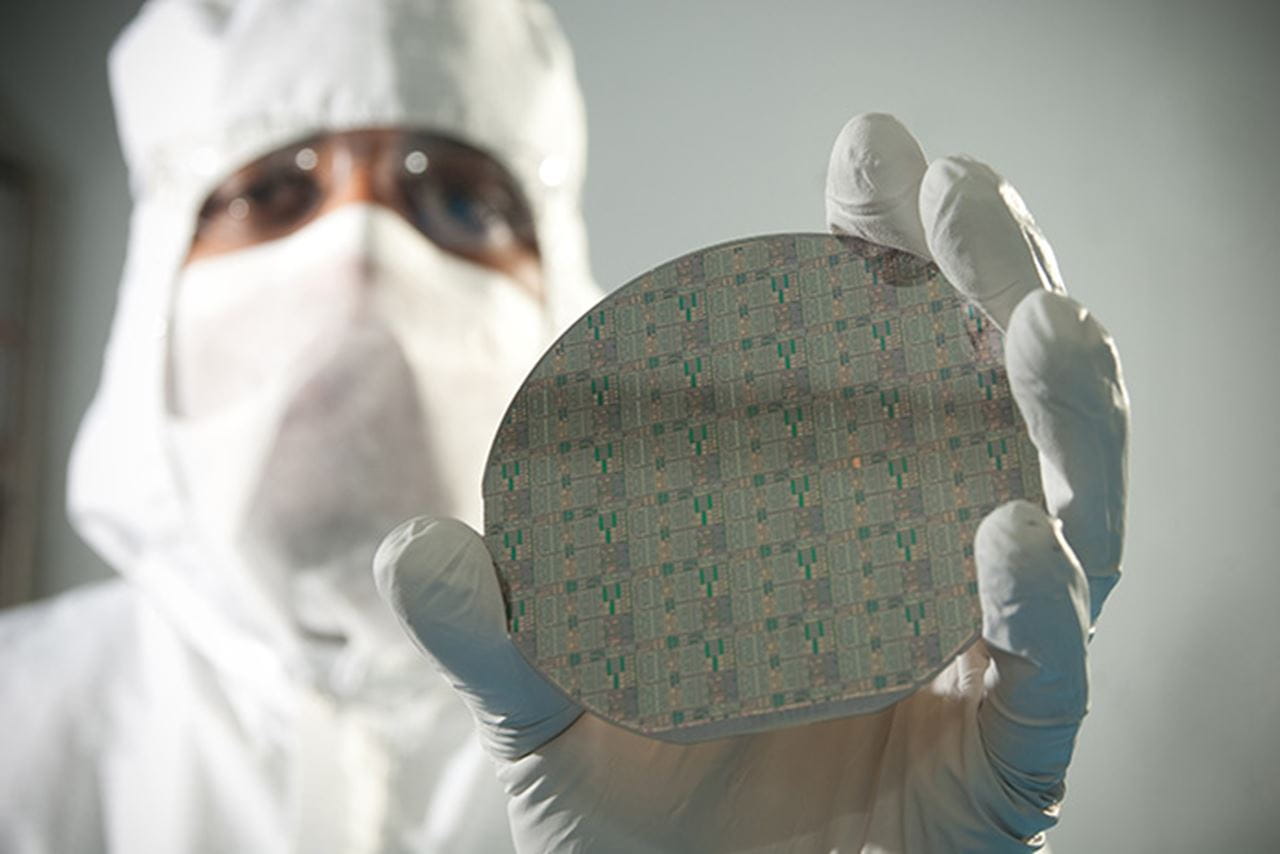 scientist holding GaN semi-conductor