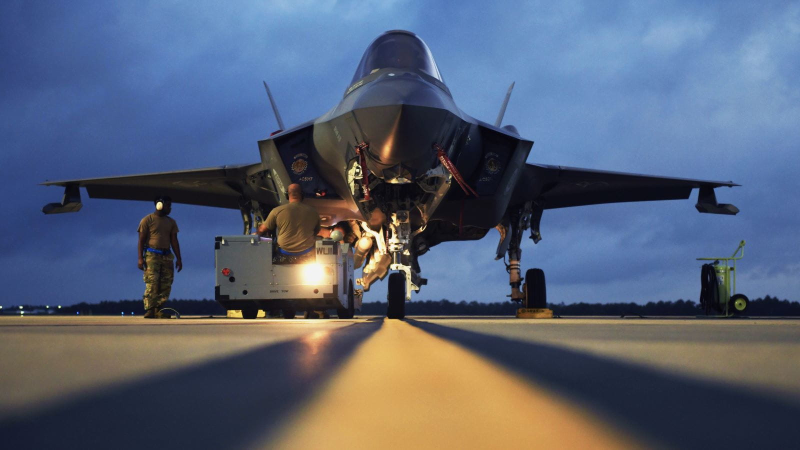 An F-35 is parked on the tarmac. 