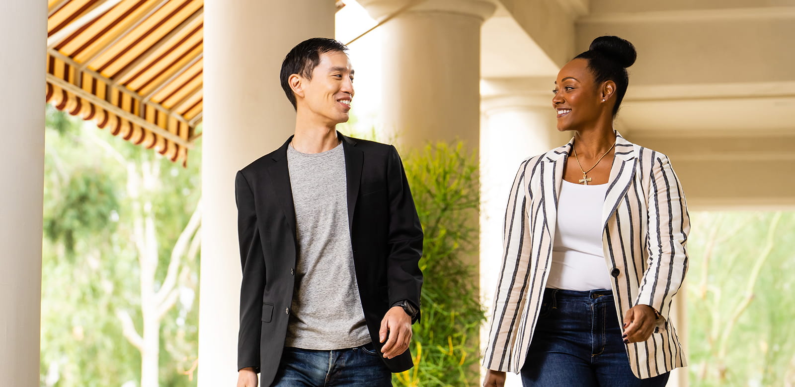 Two people walk side by side