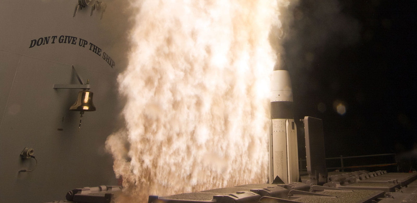 SM-3 missile being launched from a ship with fire blasting upward