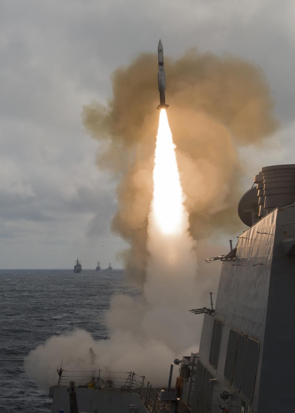 A 1,500-pound SM-2 missile leaps from the guided-missile destroyer USS Roosevelt (DDG 80) at twice the speed of sound to destroy an advanced high-speed target while USS Monterey (CG 61), USS Stout (DDG 55) and USS Mason (DDG 87) transit in formation. (Photo: U.S. Navy)
