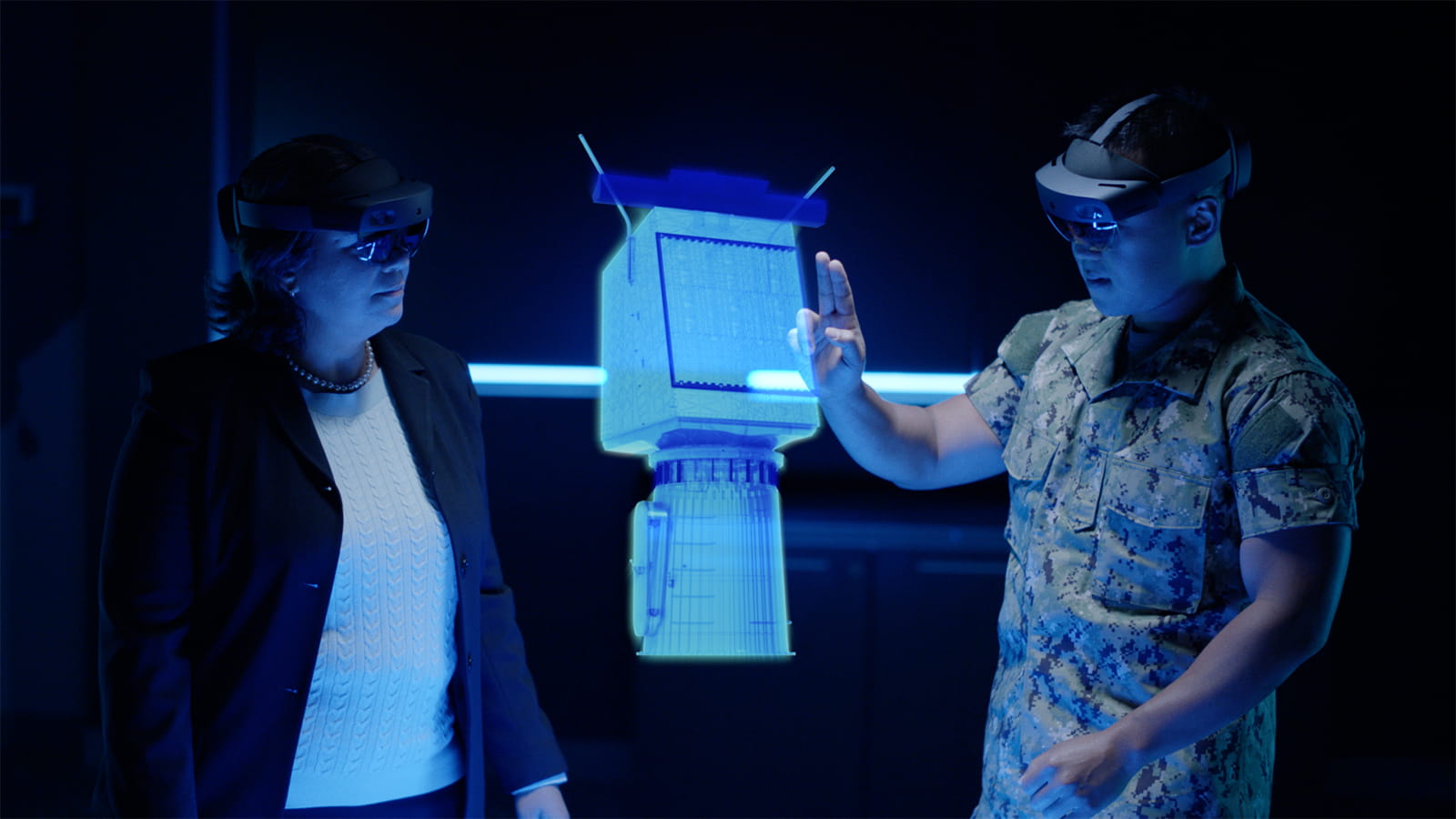 Two people collaborate in a digital environment while assessing the U.S. Navy's SPY-6 radar. 