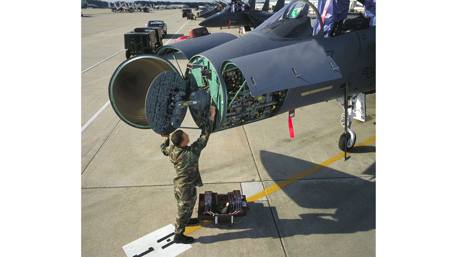 A technician inspects the APG-70 radar installed into one of the first F-15E Strike Eagles.