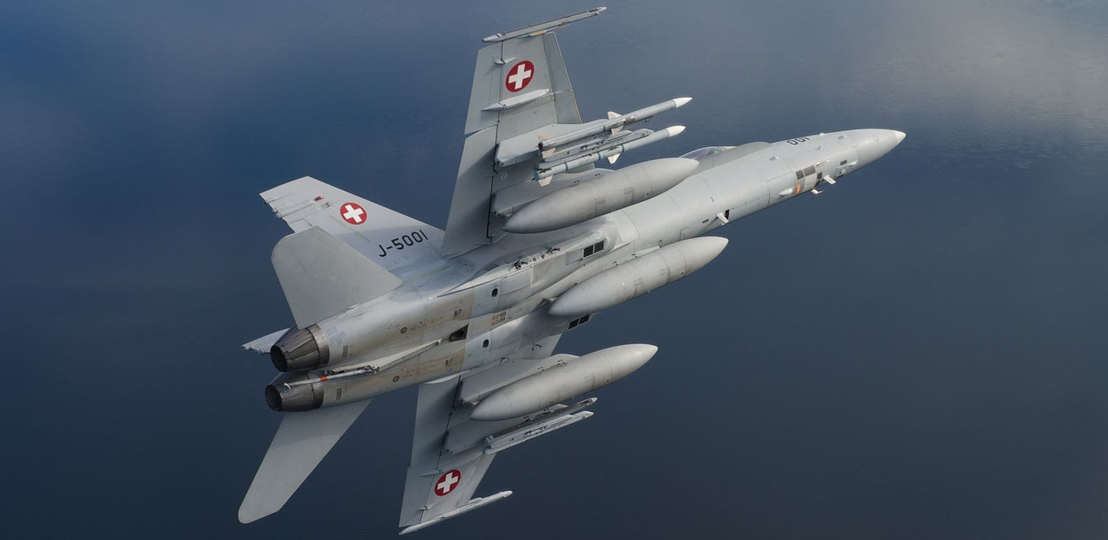 Switzerland fires an AIM-120C7 AMRAAM missile from this F-18 as part of the international Thor’s Hammer exercises in Sweden. Military leaders from four countries worked together to successfully test five AMRAAM missiles.