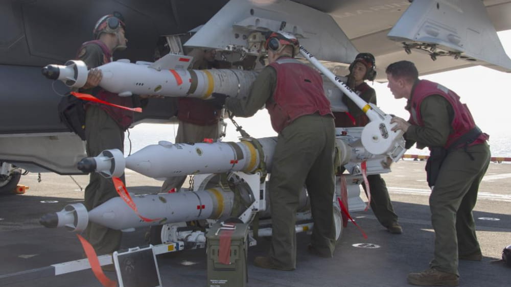 Marines load a Paveway laser-guided bomb onto an F-35B Lightning II (Photo: U.S. Navy)