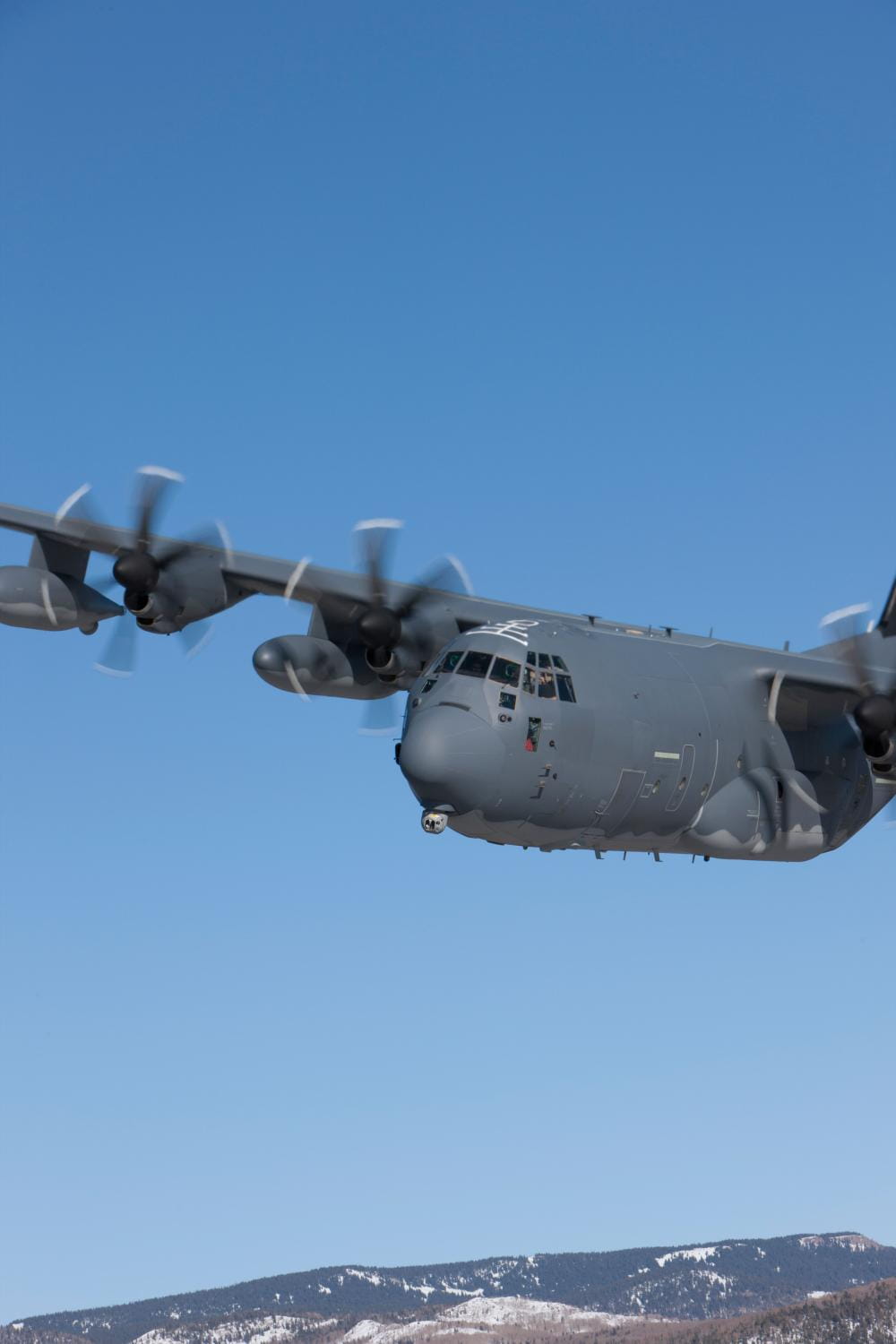 An HC-130J flies a mission with a Multi-Spectral Targeting System