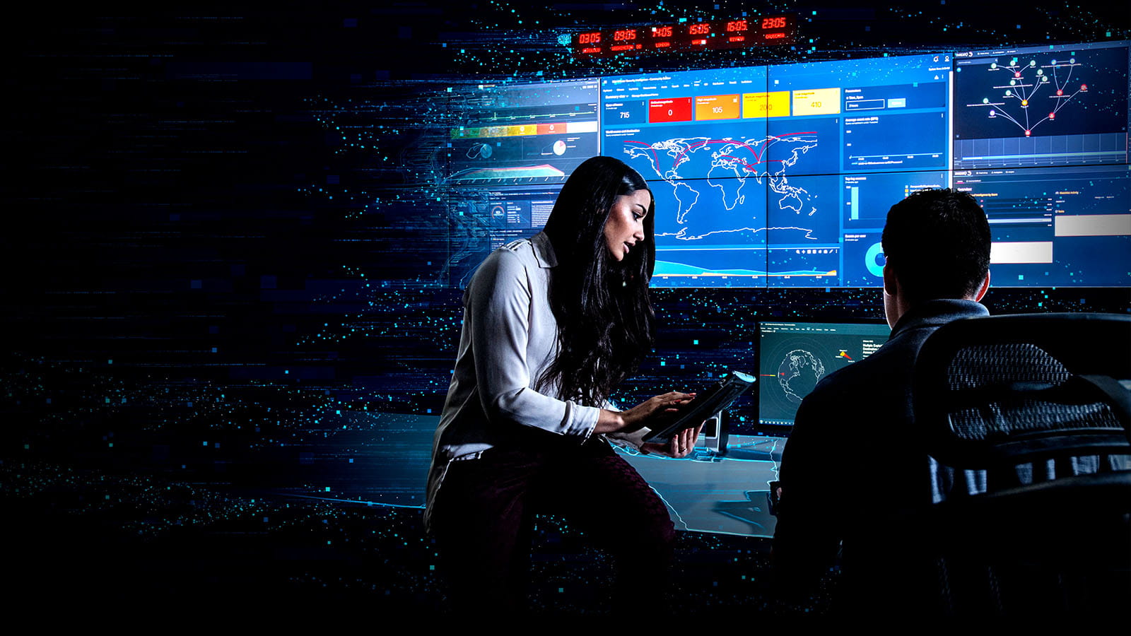 Two employees in cyber command center with digital overlay