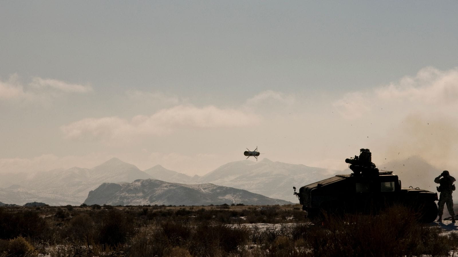 The TOW missile fires from its launcher.