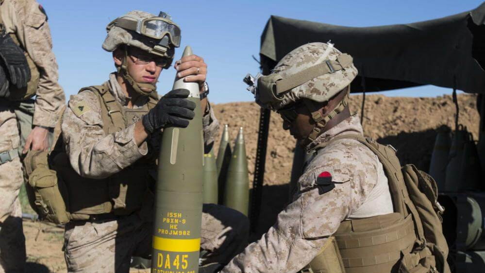 The U.S. Marine Corps prepare an Excalibur® 155 mm projectile round on Fire Base Bell, Iraq, while conducting fire missions. (Photo: U.S. Marine Corps)