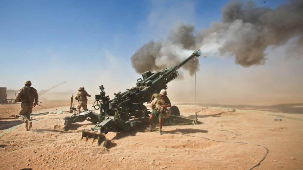 U.S. Marines fire an M982 Excalibur projectile round from an M777 155 mm howitzer during a fire support mission at Fire Base Fiddlers Green, Helmand province. (Photo: U.S. Department of War)