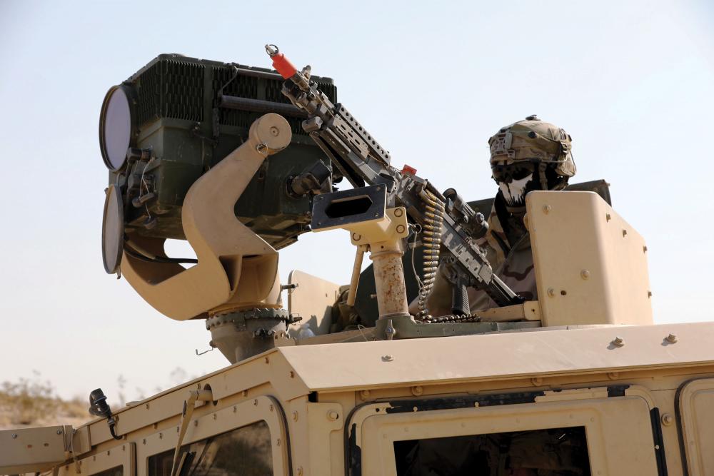 A U.S. Army soldier watches over tanks in his unit with a 3rd GEN FLIR™-equipped Long Range Advanced Scout Surveillance System during Decisive Action Rotation 18-01 at the National Training Center in Fort Irwin, California. (Photo: U.S. Army)