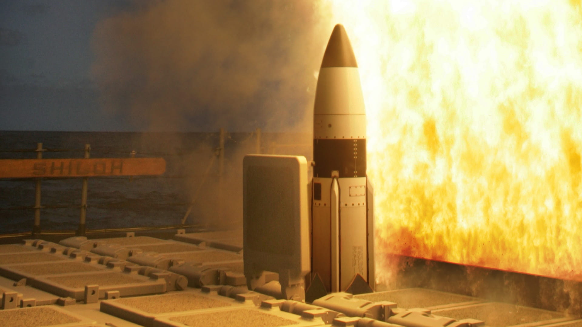 SM-3 launch with fiery exhaust plumes 