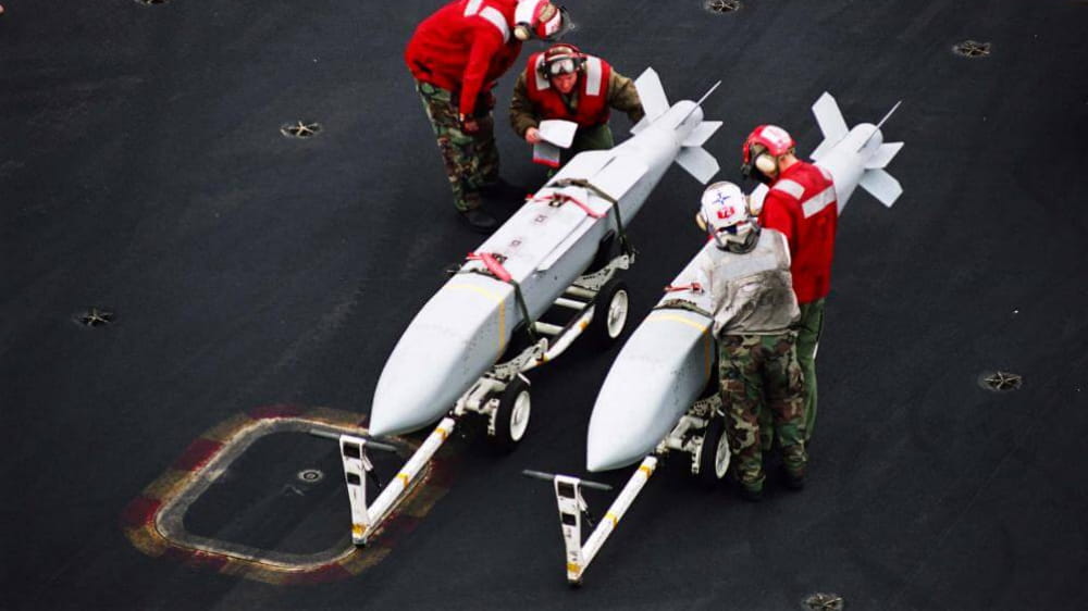 Aviation ordnancemen inspect JSOW® munitions aboard USS Abraham Lincoln (CVN 72) before transferring them to waiting aircraft. JSOW delivers precision standoff strike capability against stationary land targets from launch ranges of up to 70 nautical miles. (Photo: U.S. Navy)
