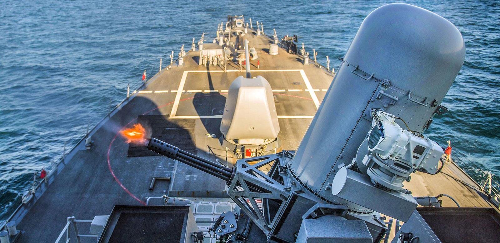 A Plalanx rapid-firing from the deck of a ship