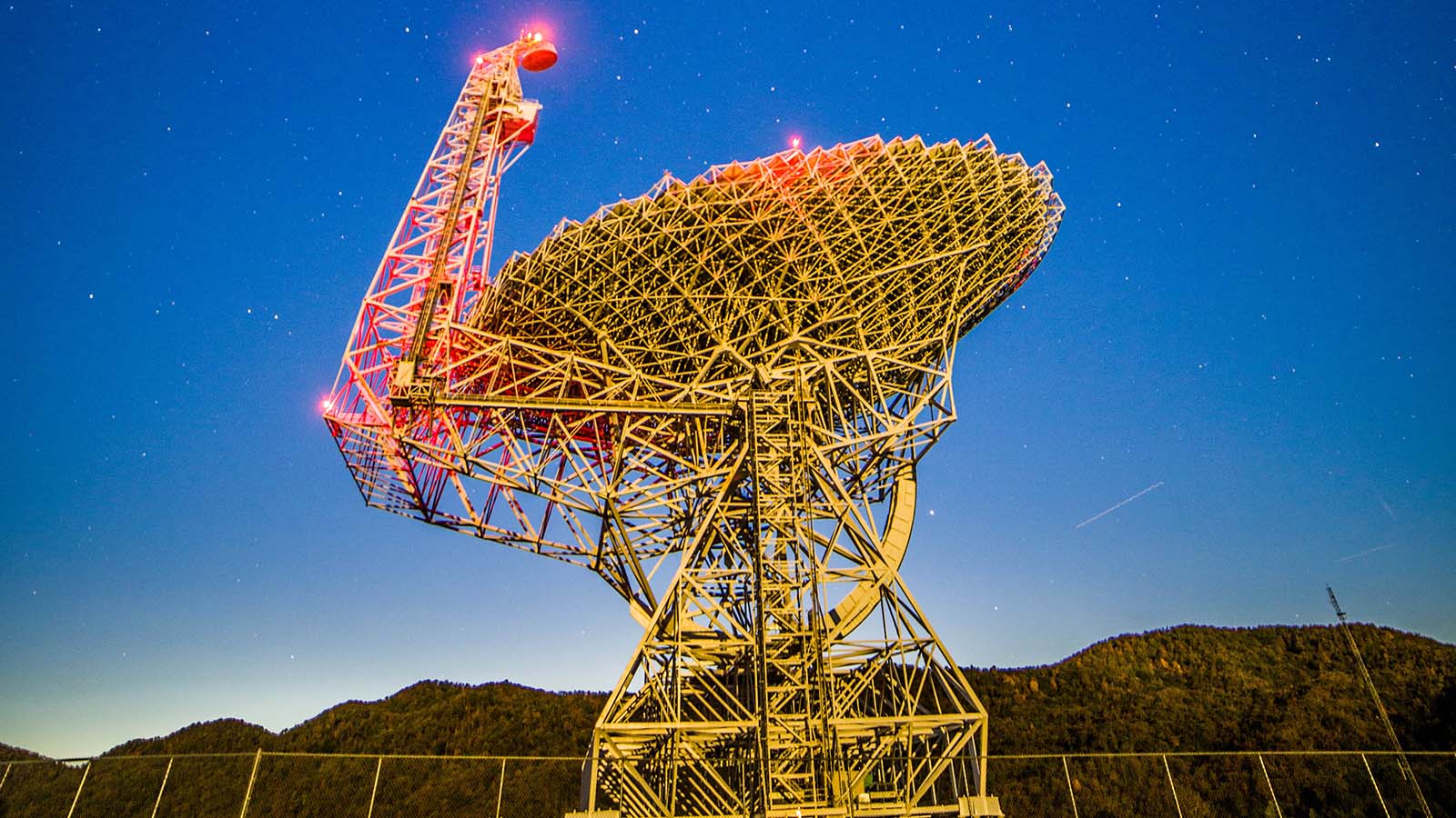 Green Bank Observatory and star filled blue sky