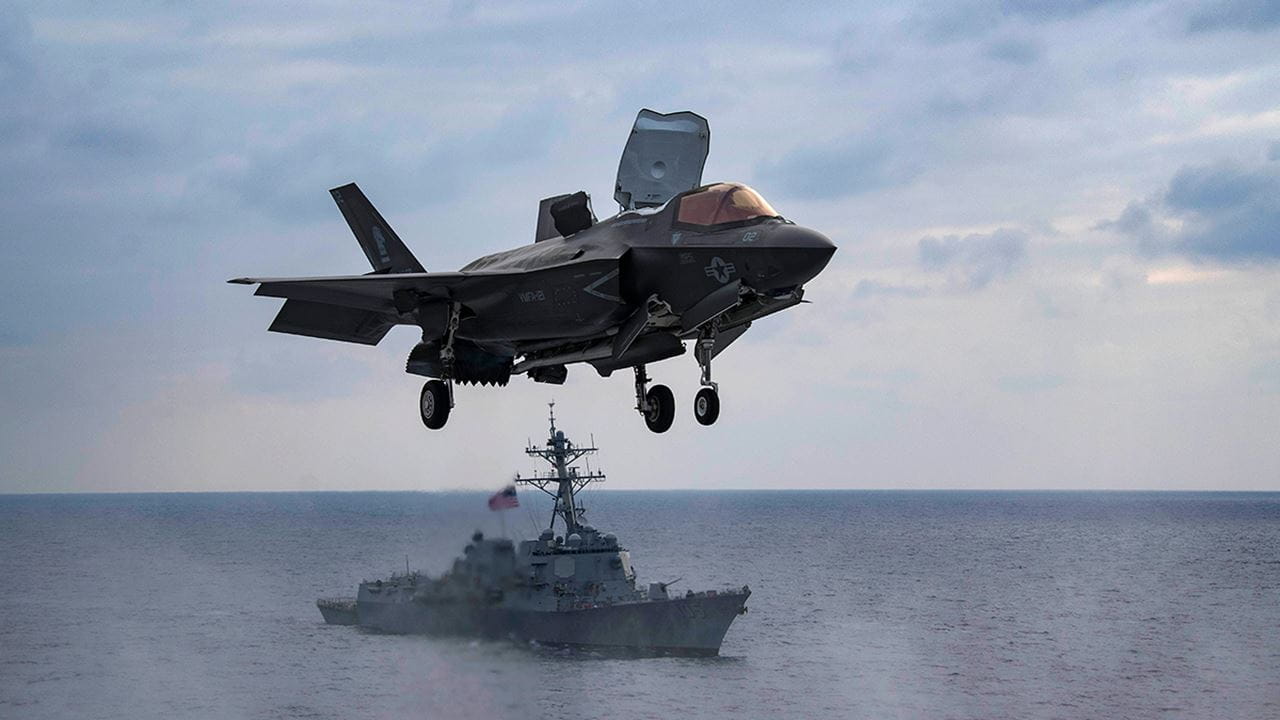 Fighter jet taking off from an amphibious assault ship
